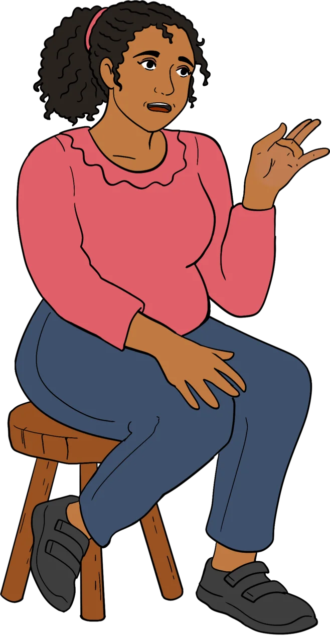 The image shows a young woman with brown skin and curly dark hair pulled back with a pink hairtie. She is seated on a wooden stool, wearing a pink ruffle-neck long-sleeve top and blue jeans with black shoes. She gestures with one hand as if mid-conversation, with a thoughtful or expressive look on her face. The background is muted mauve.