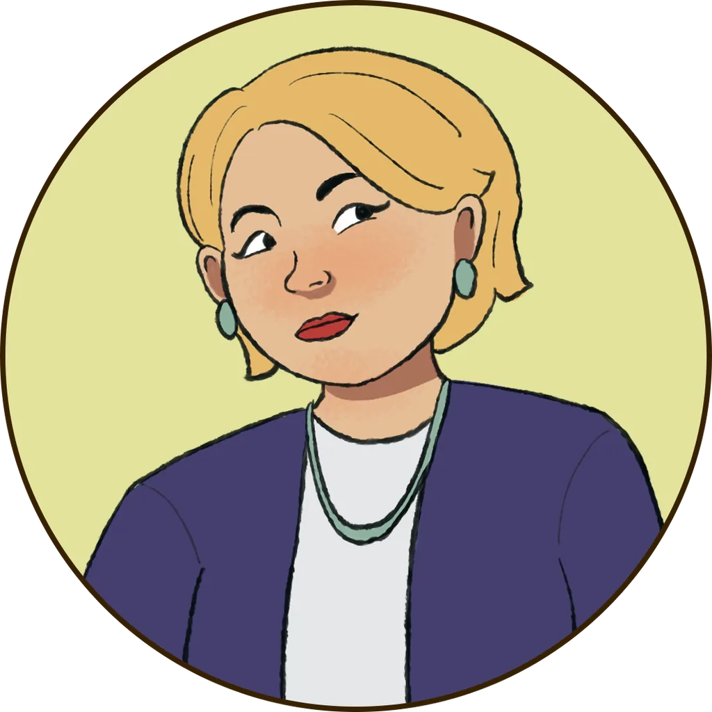 A Caucasian woman with a round face and short blonde hair, smartly dressed in a dark blue blazer and a light blue top underneath, with a silver necklace and round blue earrings. She is Tatiana.